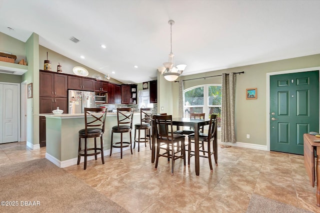 5479 Saint Regis Way, Port Orange, FL 32128 - dining room featuring a chandelier, vaulted ceiling, and recessed lighting