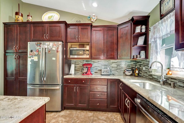 5479 Saint Regis Way, Port Orange, FL 32128 - kitchen featuring stainless steel appliances, reddish brown cabinets, vaulted ceiling, open shelves, and tasteful backsplash