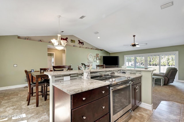 5479 Saint Regis Way, Port Orange, FL 32128 - kitchen featuring stainless steel electric range oven, open floor plan, a chandelier, vaulted ceiling, and dark brown cabinets