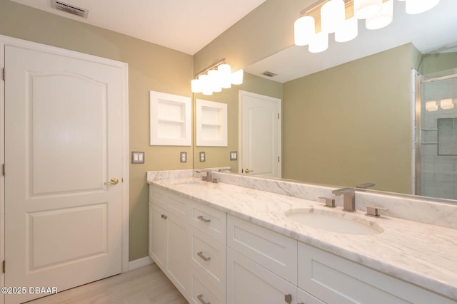 5479 Saint Regis Way, Port Orange, FL 32128 - full bath featuring double vanity, an enclosed shower, and wood finished floors