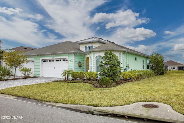 view of front facade with a garage and a front yard