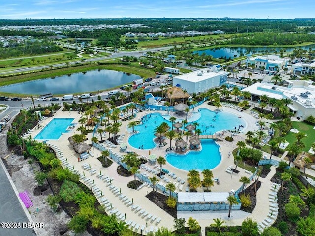 birds eye view of property with a water view