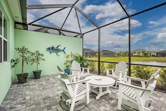 unfurnished sunroom with a water view