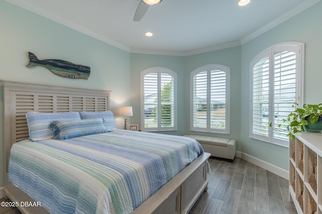 bedroom with hardwood / wood-style flooring, ceiling fan, ornamental molding, and multiple windows