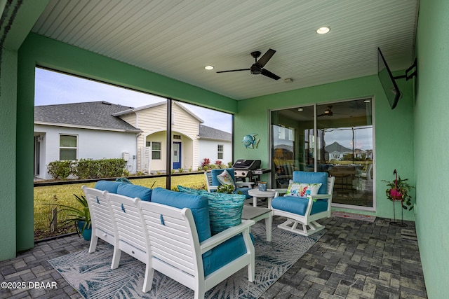 view of patio with an outdoor living space, grilling area, and ceiling fan