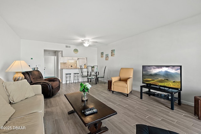 42 N Ocean Palm Villa, Flagler Beach, FL 32136 - living room featuring ceiling fan and light wood-type flooring