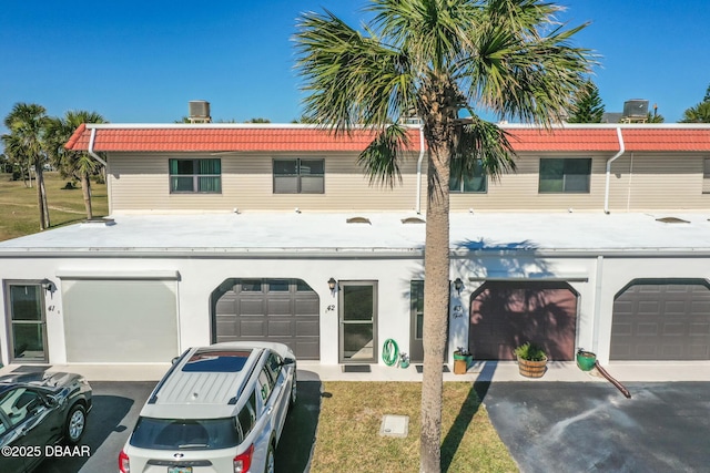 42 N Ocean Palm Villa, Flagler Beach, FL 32136 - townhome / multi-family property with a garage