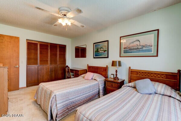 bedroom with light colored carpet and ceiling fan