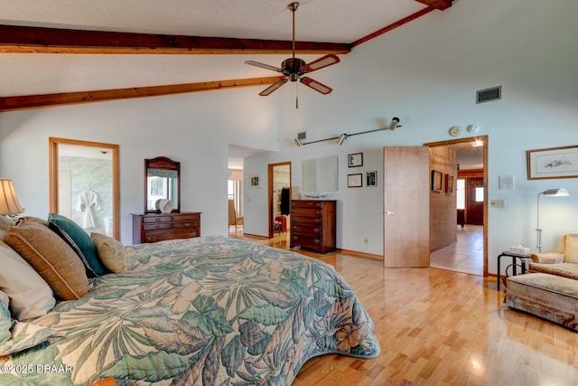 bedroom with baseboards, visible vents, high vaulted ceiling, beamed ceiling, and light wood-type flooring