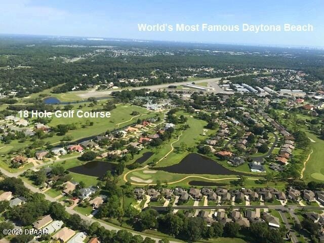 birds eye view of property with view of golf course