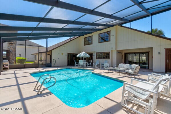 outdoor pool featuring a lanai, an outdoor living space, and a patio