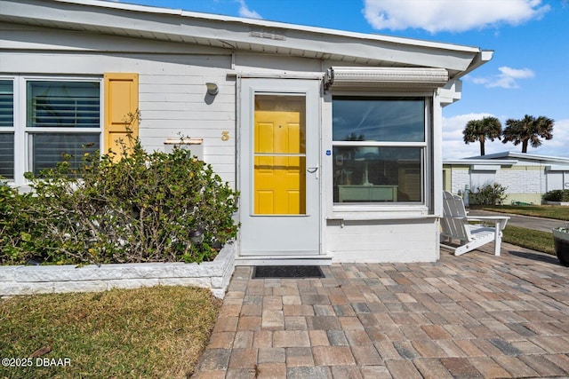 doorway to property featuring a patio