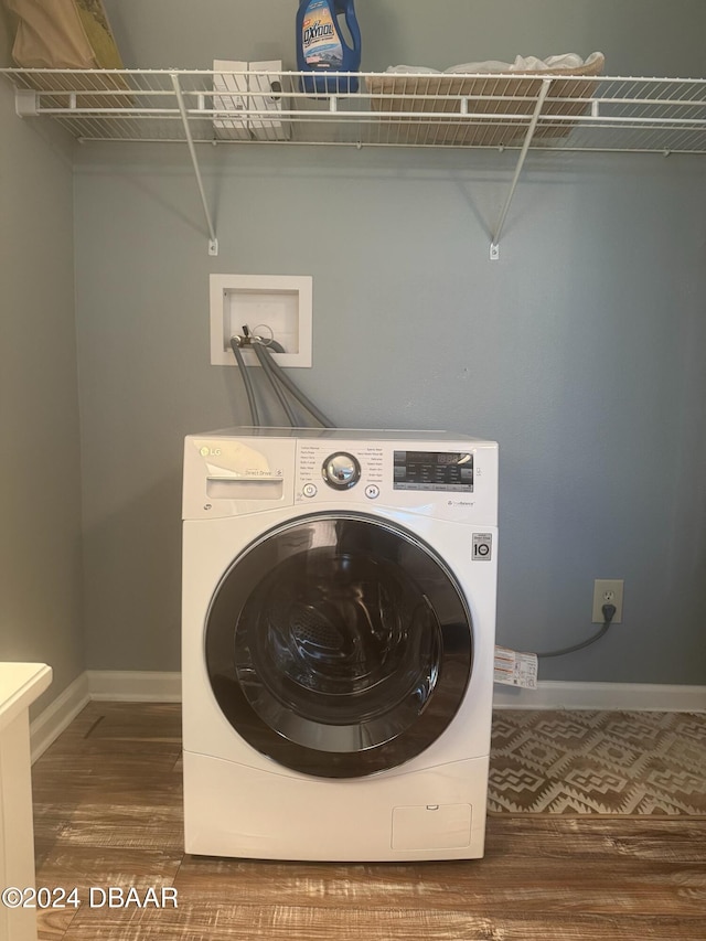 washroom featuring washer / clothes dryer and wood-type flooring