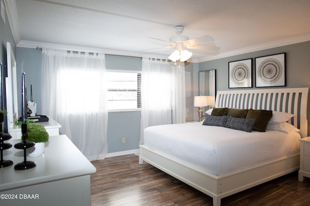 bedroom with ceiling fan, dark hardwood / wood-style floors, and ornamental molding