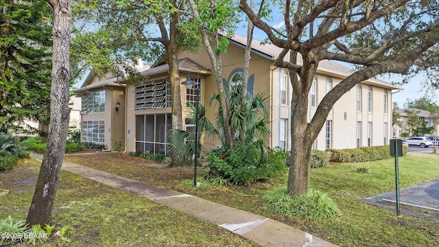 671 Wellington Station Blvd Unit 19, Ormond Beach, FL 32174 - exterior space featuring a front lawn and stucco siding