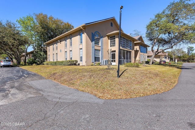 671 Wellington Station Blvd Unit 19, Ormond Beach, FL 32174 - view of front of home with stucco siding and a front yard