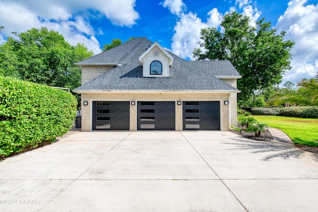 garage with concrete driveway