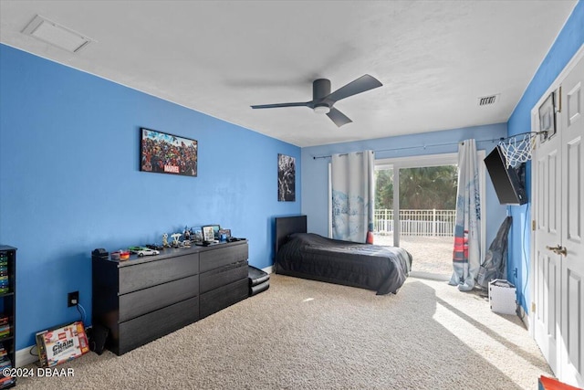 bedroom with carpet, access to outside, visible vents, and a ceiling fan