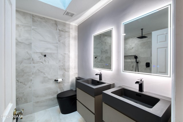 full bath featuring visible vents, a sink, tile walls, and tiled shower