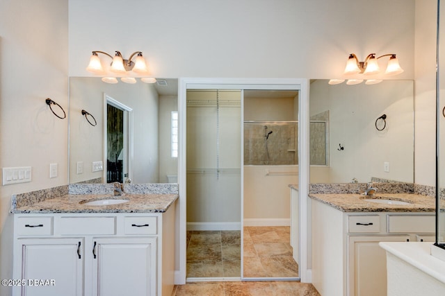 bathroom with vanity and an enclosed shower