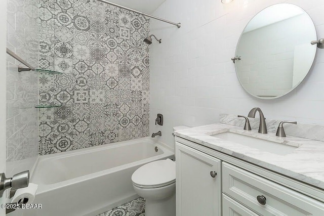 bathroom featuring vanity, shower / bathtub combination, and toilet