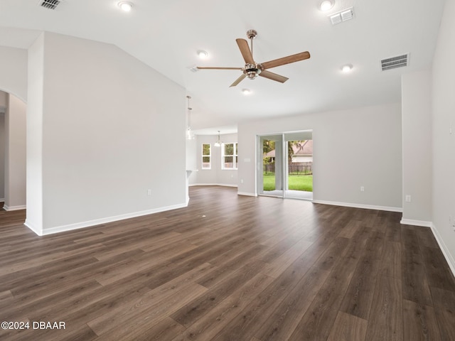 unfurnished living room with dark hardwood / wood-style flooring, lofted ceiling, and ceiling fan