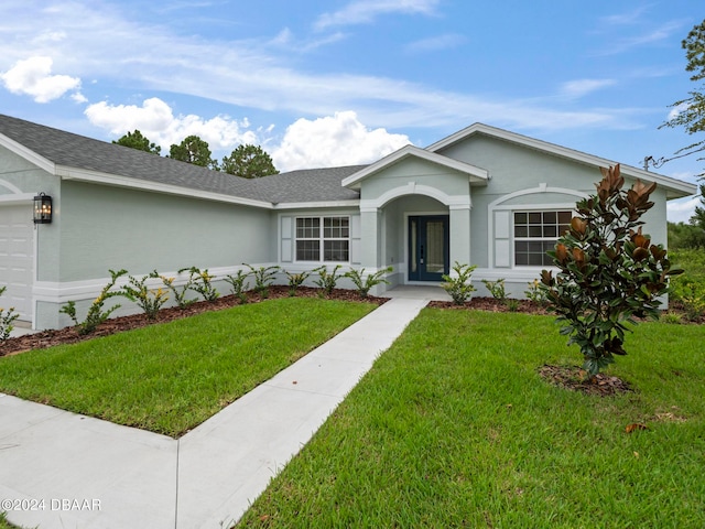 ranch-style home with a front yard