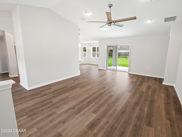 unfurnished living room featuring dark hardwood / wood-style flooring, lofted ceiling, and ceiling fan