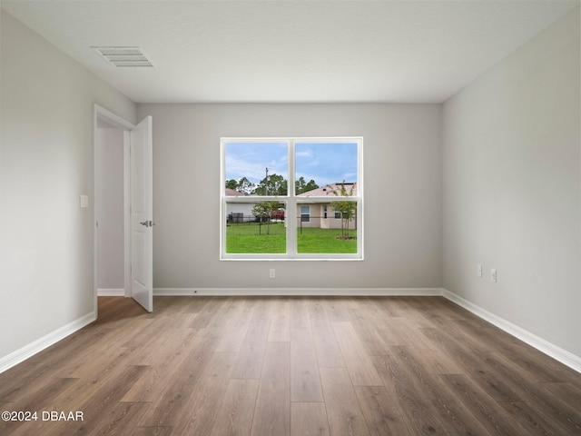 empty room featuring wood-type flooring