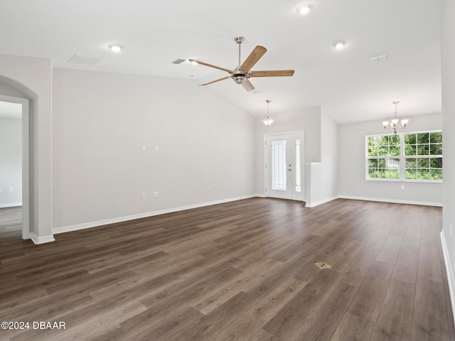 unfurnished living room featuring dark hardwood / wood-style flooring, vaulted ceiling, and ceiling fan with notable chandelier