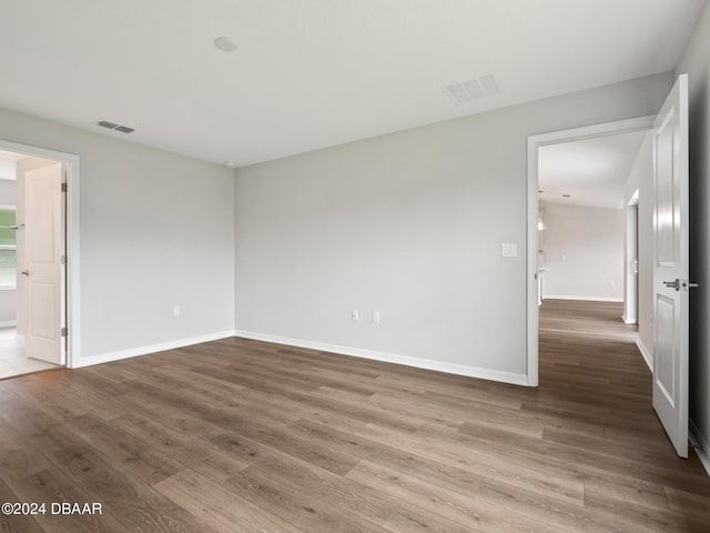 unfurnished room featuring hardwood / wood-style floors