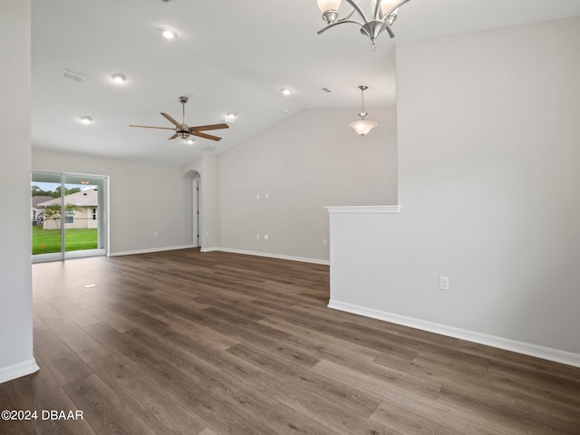 unfurnished room featuring ceiling fan with notable chandelier, lofted ceiling, and dark hardwood / wood-style floors