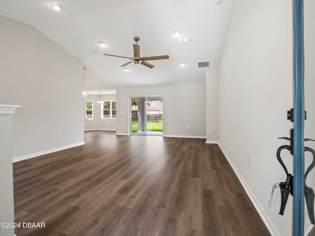 unfurnished living room featuring lofted ceiling, dark hardwood / wood-style floors, and ceiling fan