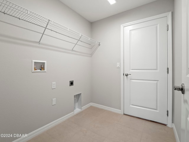 clothes washing area with hookup for an electric dryer and hookup for a washing machine