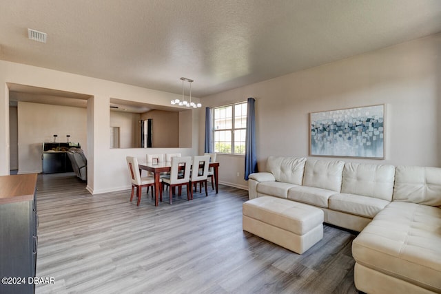 living room with hardwood / wood-style floors and a textured ceiling