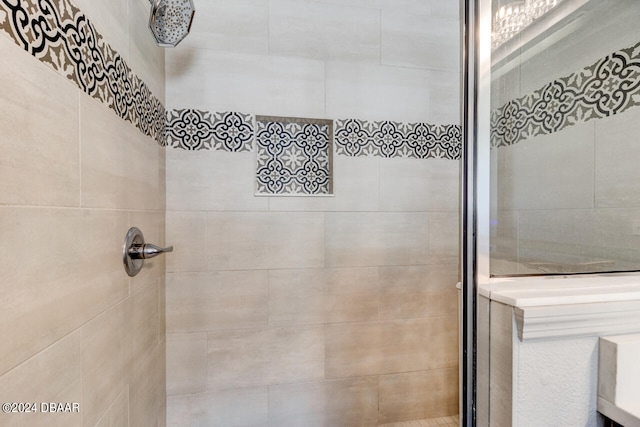 bathroom with a tile shower