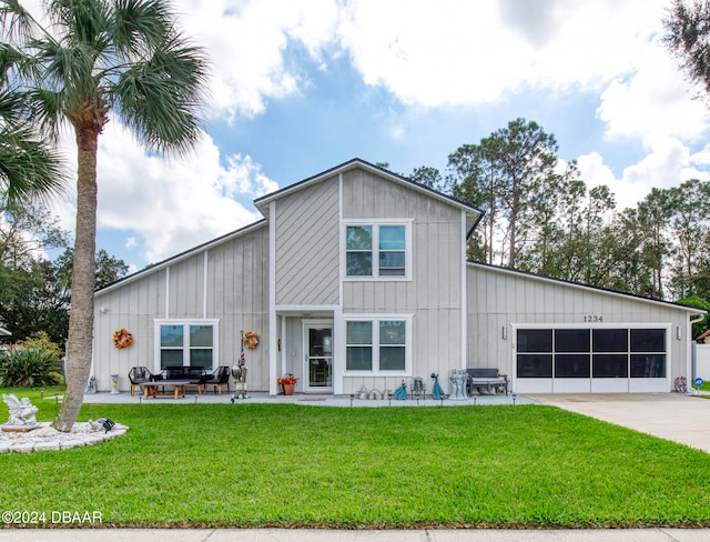 view of front facade featuring a front yard and a garage