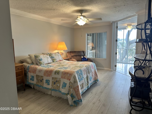 bedroom featuring ceiling fan, light hardwood / wood-style flooring, crown molding, a textured ceiling, and access to outside