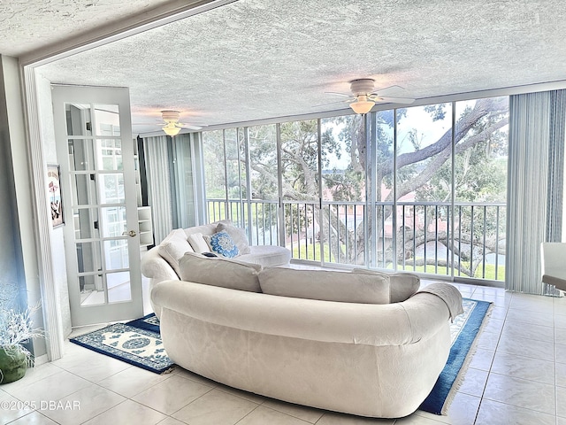 interior space featuring ceiling fan and a healthy amount of sunlight