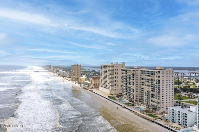 birds eye view of property featuring a water view and a view of the beach