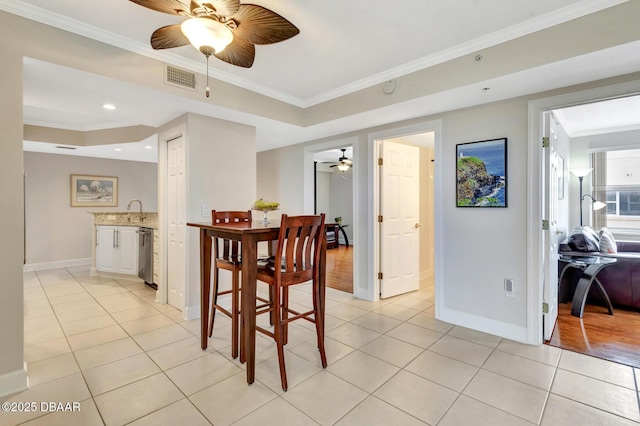 tiled dining space with crown molding