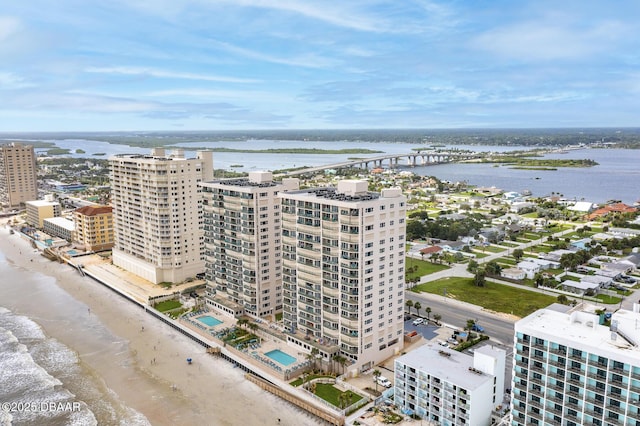 aerial view with a water view and a view of the beach