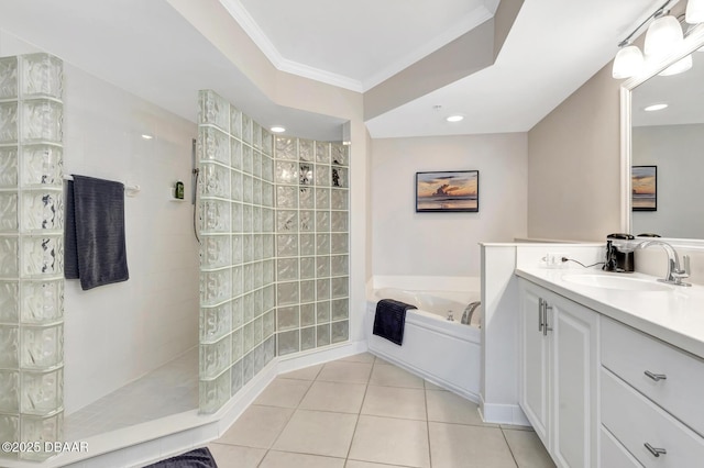 bathroom featuring tile patterned floors, vanity, ornamental molding, and shower with separate bathtub