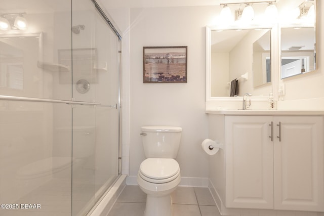 bathroom featuring vanity, toilet, tile patterned floors, and an enclosed shower