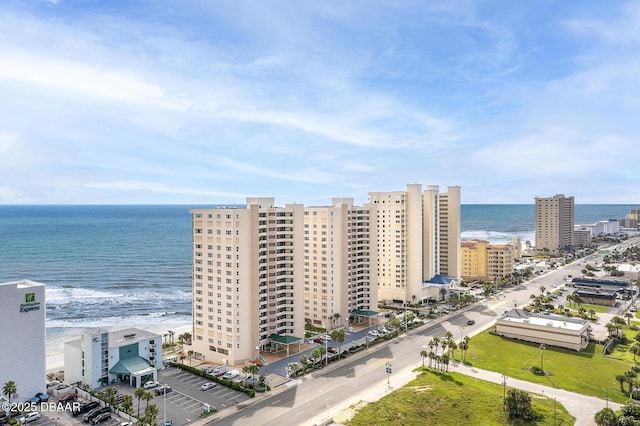 bird's eye view with a beach view and a water view