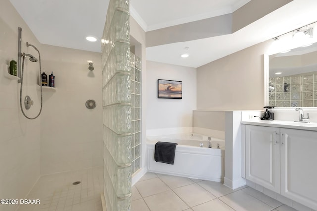 bathroom with ornamental molding, separate shower and tub, tile patterned floors, and vanity