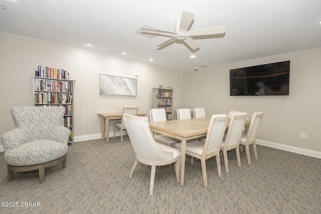 dining area featuring ceiling fan and carpet