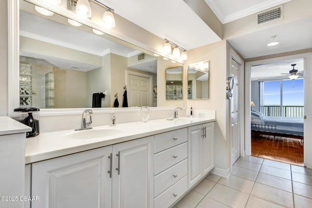 bathroom featuring vanity, ceiling fan, tile patterned floors, and crown molding