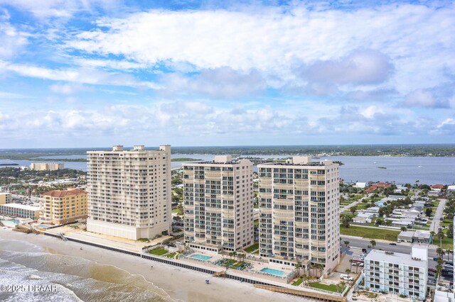 bird's eye view with a water view and a view of the beach