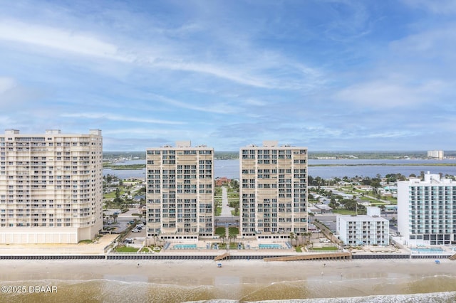 exterior space featuring a water view and a view of the beach